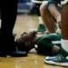 Huron senior Nasheed Bass receives assistance after being injured in the game against Pioneer on Friday, Jan. 18. Daniel Brenner I AnnArbor.com